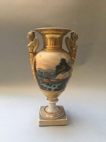 PARIS Baluster vase on porcelain pedestal with two handles showing golden winged...