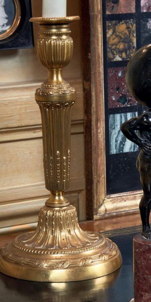 null Pair of torches mounted in chased and gilded bronze lamp, and lacquered sheet...