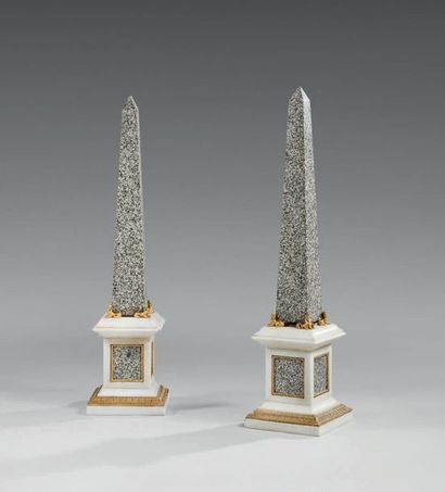 null Pair of obelisks in granite and white marble, chased and gilded bronze ornamentation,...