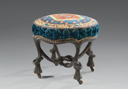 null Stool made of blackened wood, decorated with trimmings, the feet in the shape...