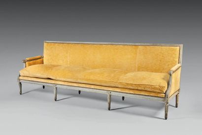 null Monumental sofa in moulded, carved and grey painted wood, the armrests fully...