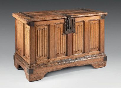 null Moulded and carved oak chest; rectangular in shape, it opens with a hinged lid...
