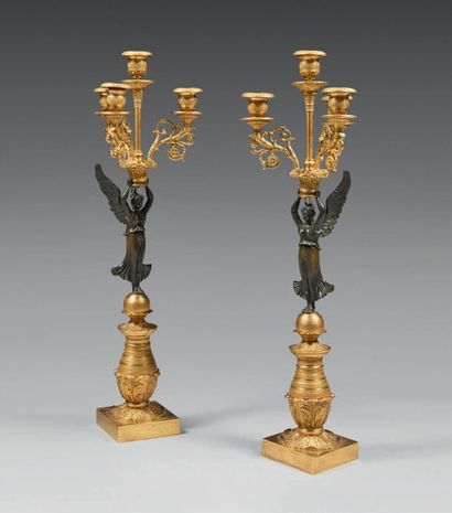 null Pair of four-light candelabra in chased, knurled, gilded or patinated bronze;...
