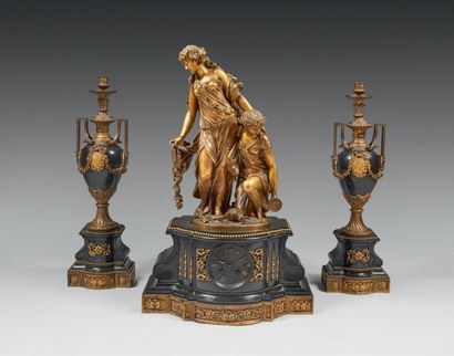 null Important chased or gilded bronze and black marble mantel set; the clock represents...