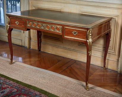 null Mahogany and mahogany veneer desk, with chiselled and gilded bronze ornamentation,...