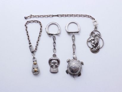 null Set of 4 silver key rings featuring an old man holding a child in his arms,...