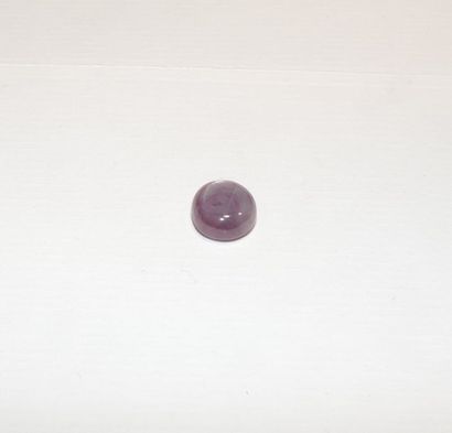 null A cabochon-cut ruby. Dimensions: approx. 10.7 x 10.1 x 4.5 mm. Chevrons visible....