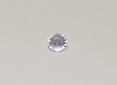 null A faceted pink spinel of round shape. Dimensions: approx. 5.1 x 5 x 2.5 mm....