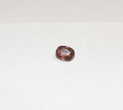 null An oval-shaped faceted brown tourmaline. Dimensions: approx. 7.4 x 5.6 x 3.4...