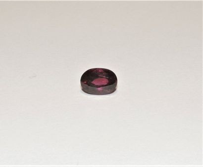null A faceted pink oval tourmaline. Dimensions: approx. 10.1 x 7.2 x 5.6 mm. Weight:...
