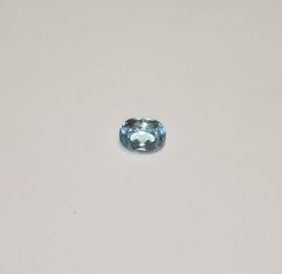 null Faceted blue topaz in an oval shape. Dimensions: approx. 15.6 x 11.8 x 8.8 mm....