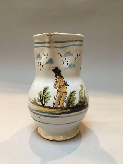 null ROANNE. Baluster-shaped jug, decorated in polychrome with a peasant in a landscape...