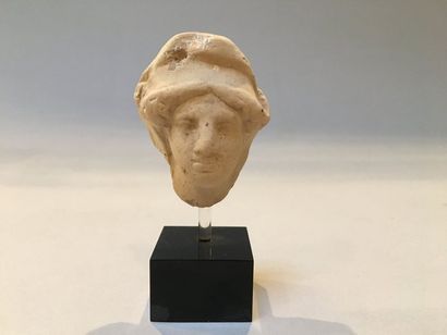 null Woman's head in the antique taste on a pedestal

Height: 9 cm