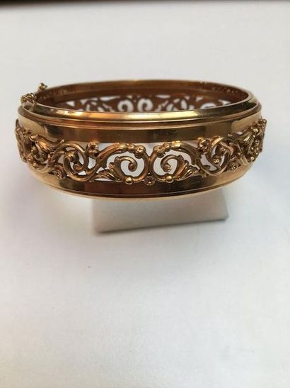null 750-thousandths gold opening band bracelet centred on an openwork frieze with...
