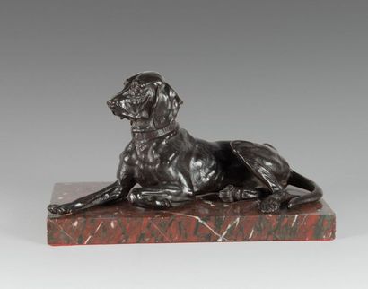 null 
Bronze lying dog with a brown-black patina. Inscription on the collar.
H: 18...