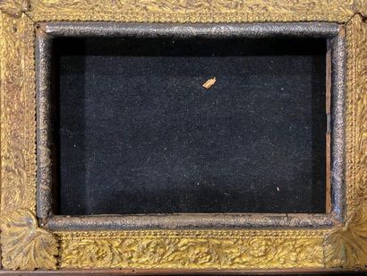 null Wooden frame with an upside-down profile decorated with embossed metal, gilded...