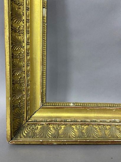 null Wooden frame and gilded paste known as ''à double gorge'' with palmette decoration....