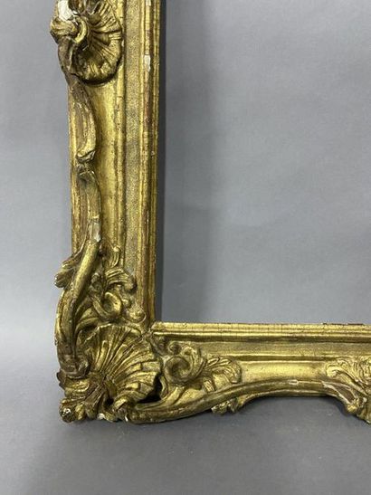 null Sculpted and gilded lindenwood frame decorated with shells and openwork foliage

Louis...