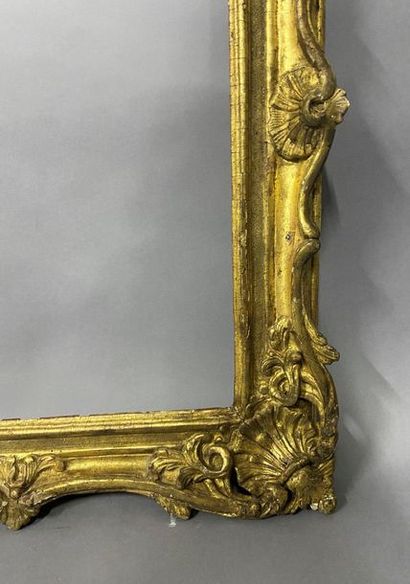 null Sculpted and gilded lindenwood frame decorated with shells and openwork foliage

Louis...