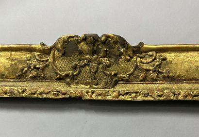 null Sculpted and gilded oak frame with palmettes and foliage decoration in the corners...