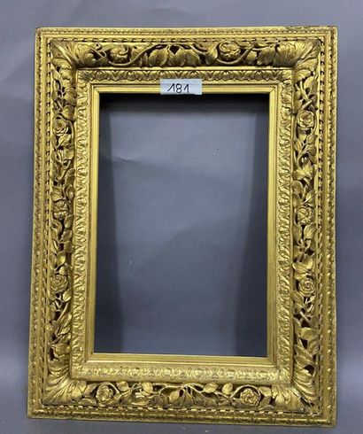 null Carved and gilded wood frame with openwork decoration of foliated and flowery...