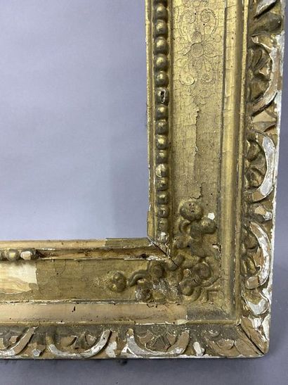 null Sculpted and formerly gilded linden wood frame called "à cassetta". 

Italy...