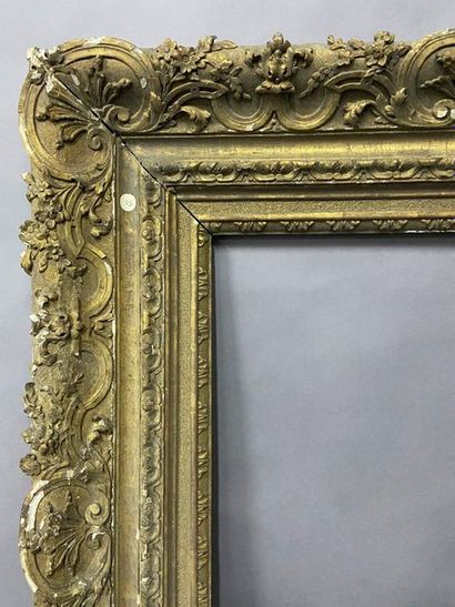 null Beautiful carved and gilded oak frame with a rich decoration of foliage and...