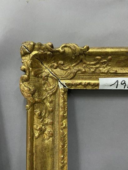 null Sculpted and gilded oak frame with shells and rinceaux decoration in the corners

Regency...