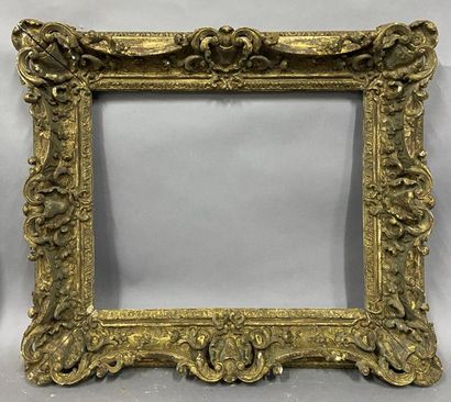 null Carved and gilded wood frame with very rich rocaille decoration, openwork shells,...