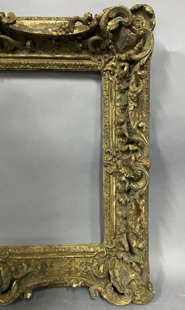 null Carved and gilded wood frame with very rich rocaille decoration, openwork shells,...