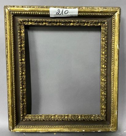 null Carved golden linden wood frame with a brown "Carlo Maratta" frame.

Italy,...