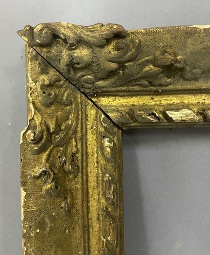 null Sculpted and gilded lindenwood frame with scroll decoration in the corners and...