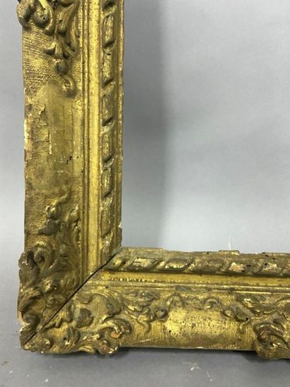 null Sculpted and gilded lindenwood frame with scroll decoration in the corners and...