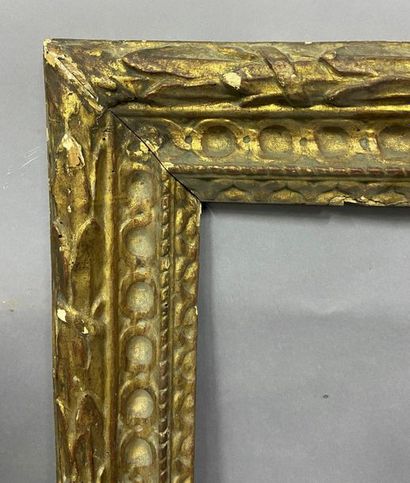 null Carved and gilded wooden frame with a laurel frieze and interlacing decoration

Bologna,...