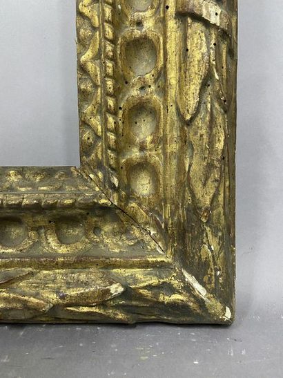 null Carved and gilded wooden frame with a laurel frieze and interlacing decoration

Bologna,...