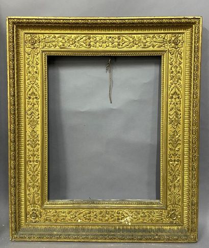 null Wooden frame and gilded pastiglia with a rich decoration of flowered rinceaux...