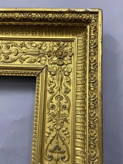 null Wooden frame and gilded pastiglia with a rich decoration of flowered rinceaux...