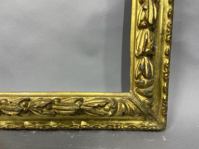 null Sculpted and gilded fir wood frame with an upside-down profile and a frieze...