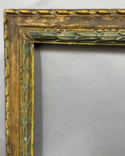null Carved wooden frame, formerly yellow and blue rechampi with a frieze of laurel...