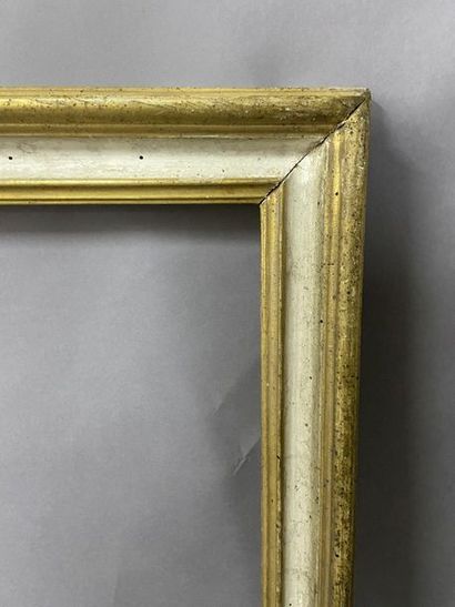 null Moulded wooden frame, gilded and white rechampi, 

Italy XVIIIth century

57.5...
