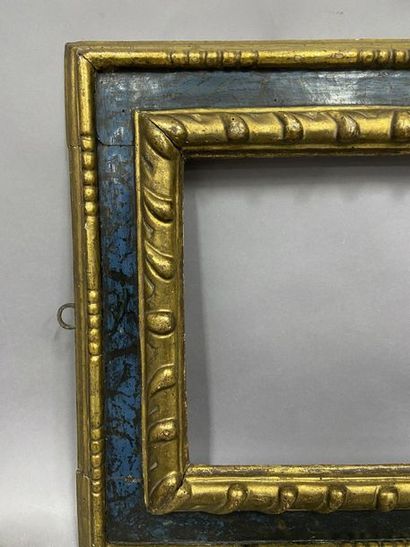 null Carved and gilded lindenwood frame with blue upside down profile, 

 Spain,...