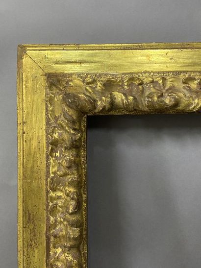 null Sculpted and gilded fir wood frame with upside down profile and acanthus frieze...