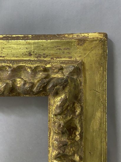 null Sculpted and gilded fir wood frame with upside down profile and acanthus frieze...