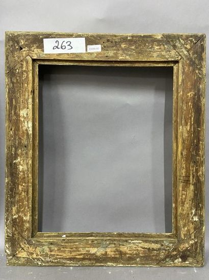 null Oak frame, carved and formerly gilded with palmette decoration and foliage in...