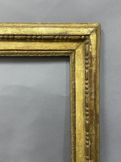 null Oak frame, carved and gilded with pearl grape decoration, 

Louis XVI period

52...