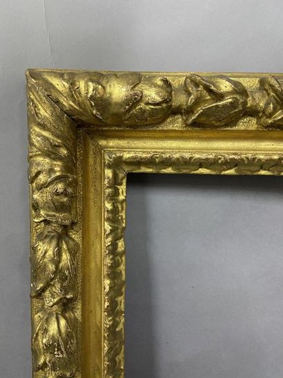 null Sculpted and gilded lindenwood frame with a frieze of laurel leaves 

 Piedmont,...