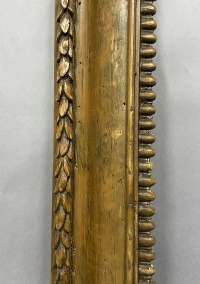 null Moulded and carved fir wood frame with gadroon decoration and wheat germ frieze,...