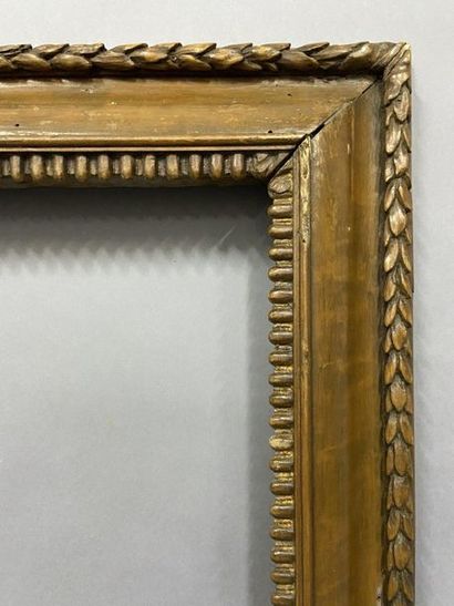 null Moulded and carved fir wood frame with gadroon decoration and wheat germ frieze,...