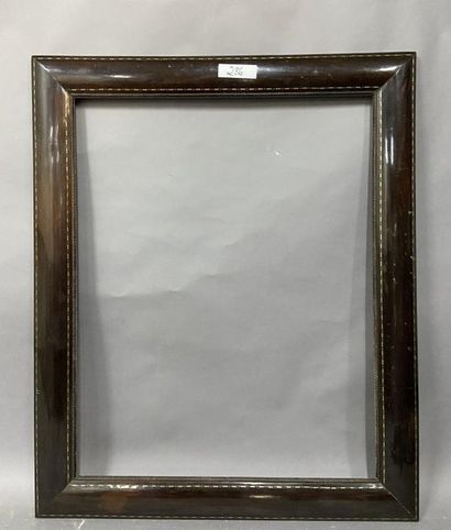 null Wooden frame with rosewood veneer, mother-of-pearl fillets and guilloche pattern...
