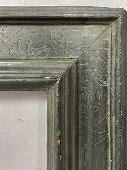 null Blackened molded linden frame with engraved decoration in the corners.

Italy,...